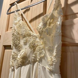 Beautiful Ivory Jumper with train like material